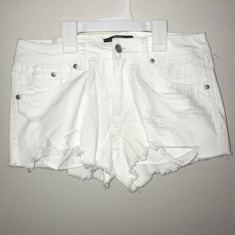 White ripped jean shorts